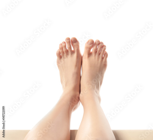 Legs of young woman taking rest  on white background
