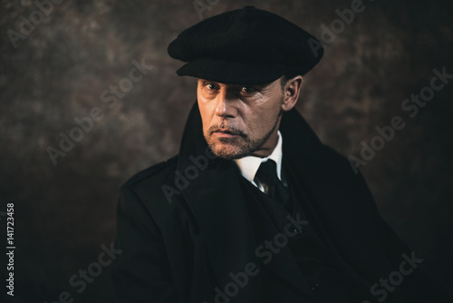 Retro 1920s english gangster. Peaky blinders style.