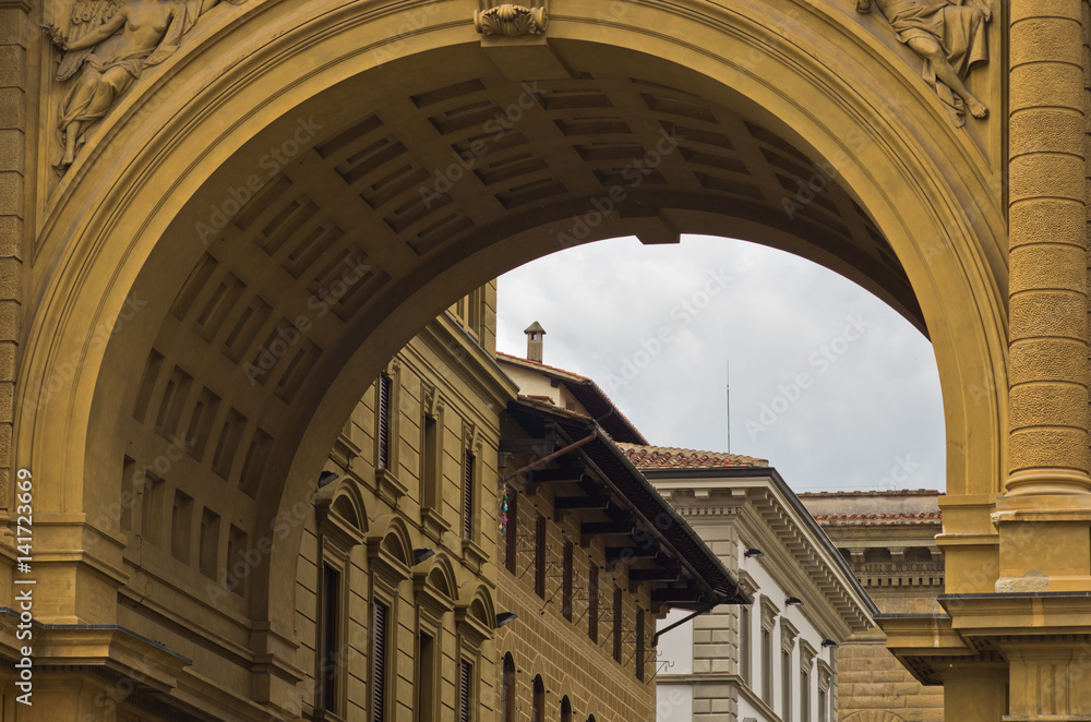 Architecture details of a big neoclassic gate on Republic square in Florence, Italy