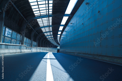 Tunnel inside of empty road surface floor