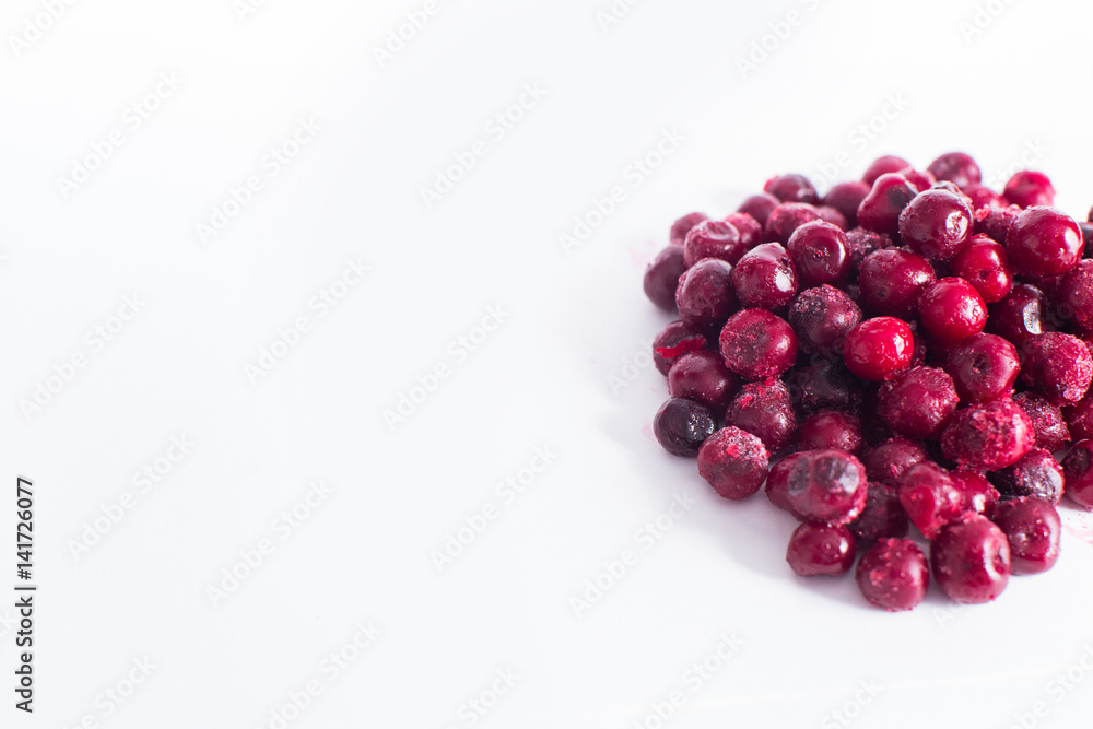 .Frozen cherries on a white background .Frozen cherries on a white background