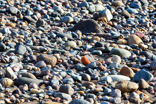 Wet pebbles on beach 