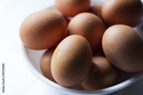 A closeup shot of eggs in a bowl. A food concept.