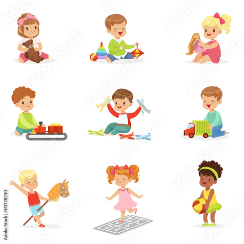 Cute Children Playing With Different Toys And Games Having Fun On Their Own Enjoying Childhood.