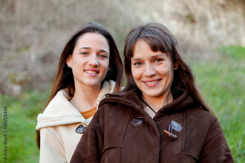 Nice sisters in a park Nice sisters in a park