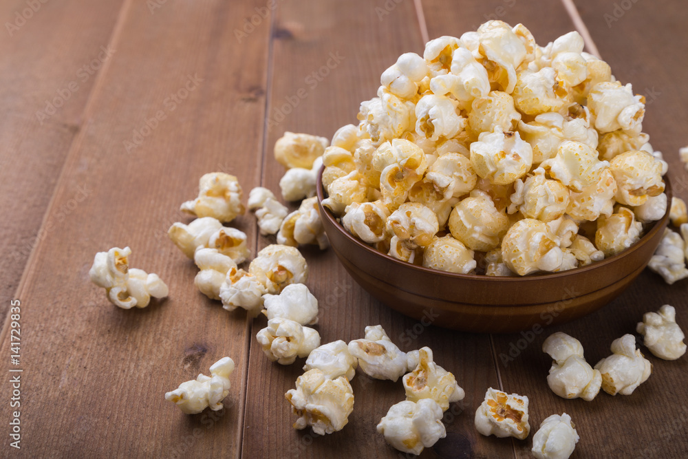 popcorn bowl on wooden popcorn bowl on wooden