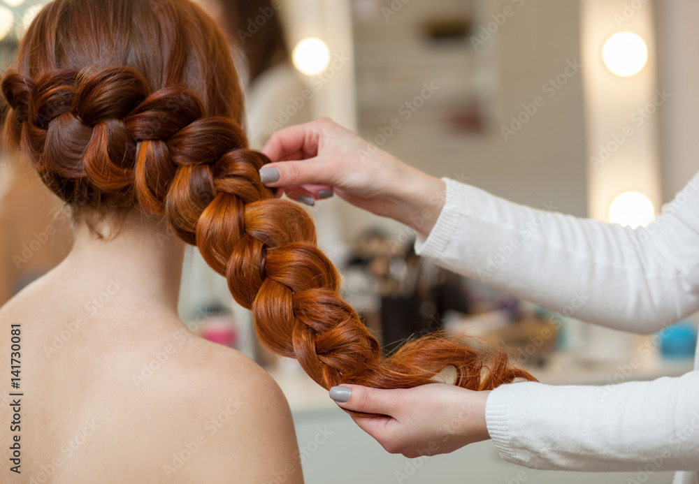 Beautiful, with long, red-haired hairy girl, hairdresser weaves a French  braid, close-up in a beauty salon. Professional hair care and creating  hairstyles. Stock Photo | Adobe Stock