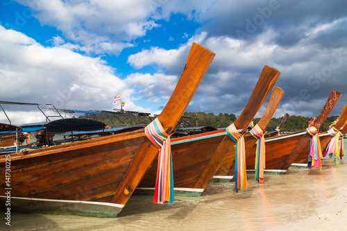 Longtail boat parking at the Thailand beach for  tourist photo