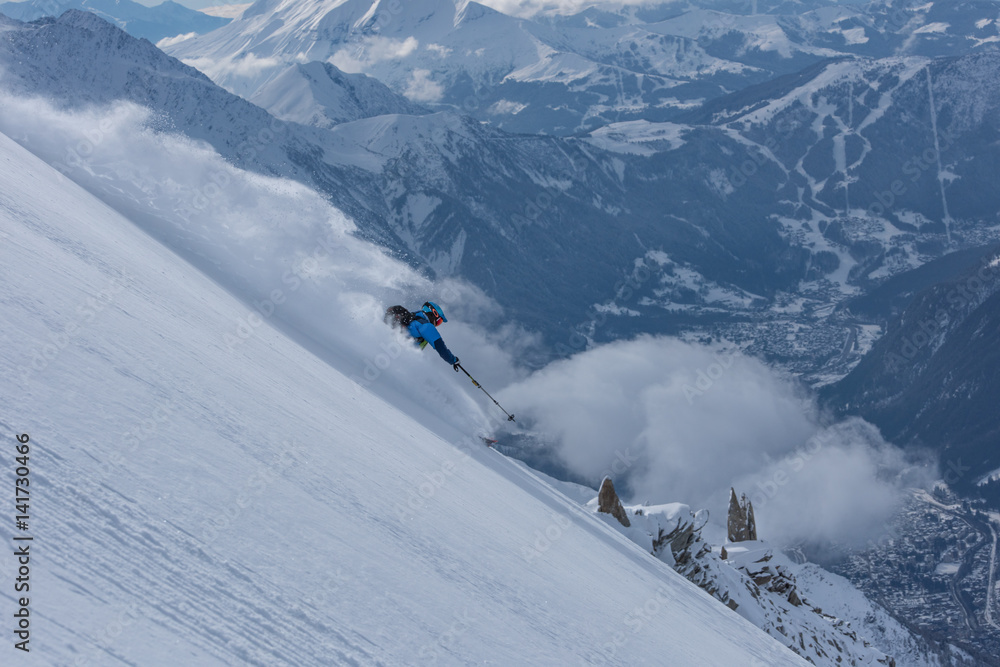 Powder skier high above Chamonix, France Powder skier high above Chamonix, France