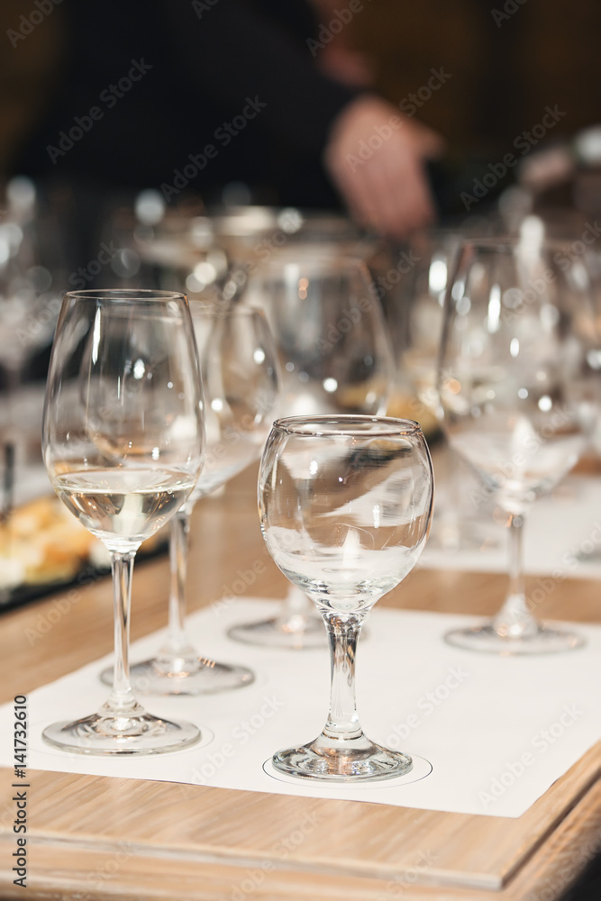 a lot of different wine glasses at wine tasting a lot of different wine glasses at wine tasting