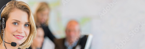 Portrait of smiling secretary in office photo