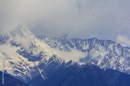 Meili snow mountain and glacier, view from Feilai temple, Deqing, Yunnan, China photo