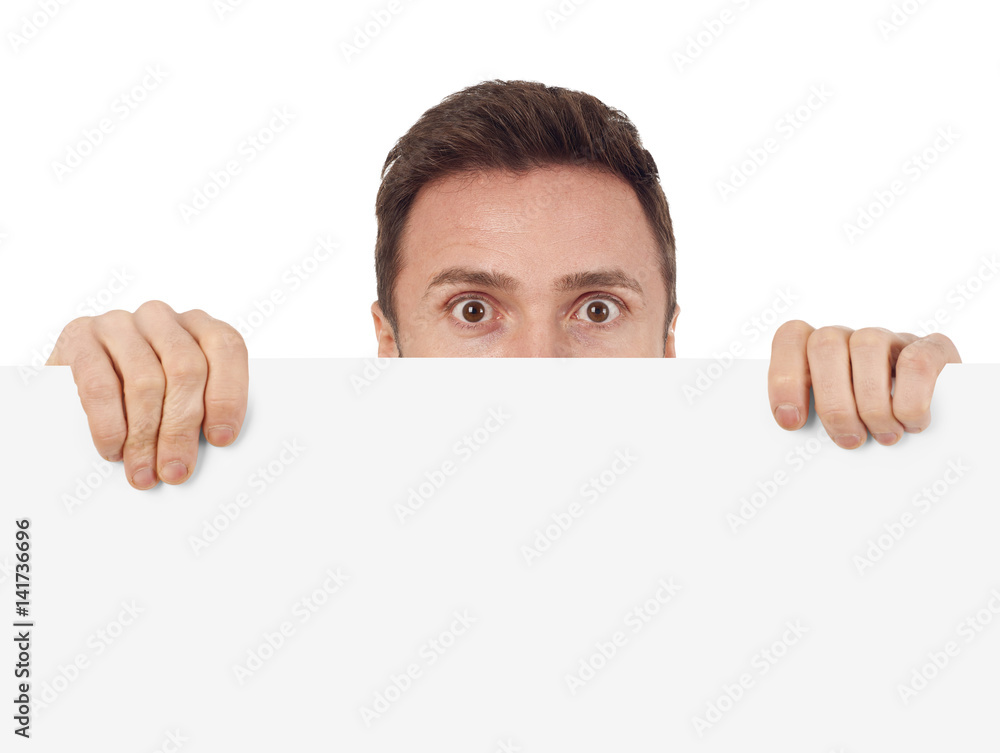 Man hiding behind a blank sign Man hiding behind a blank sign