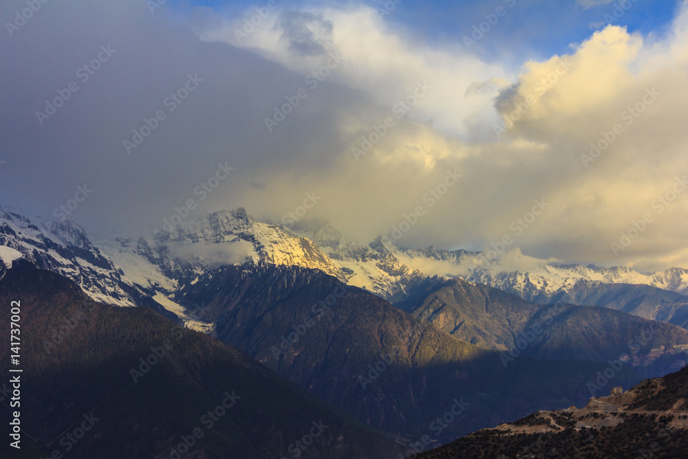 Meili snow mountain in sunrise and Mingyong glacier, at Feilai temple, Deqing, Yunnan, China