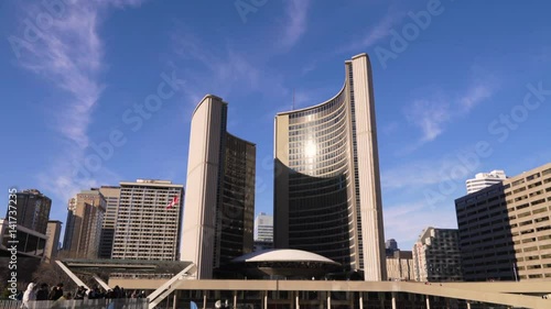 Sun Shining on Toronto City Hall Building at Nathan Phillips Square photo