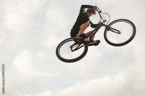 Person jumping on trial bike © kegfire