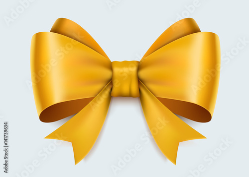Realistic yellow bow isolated on white background.