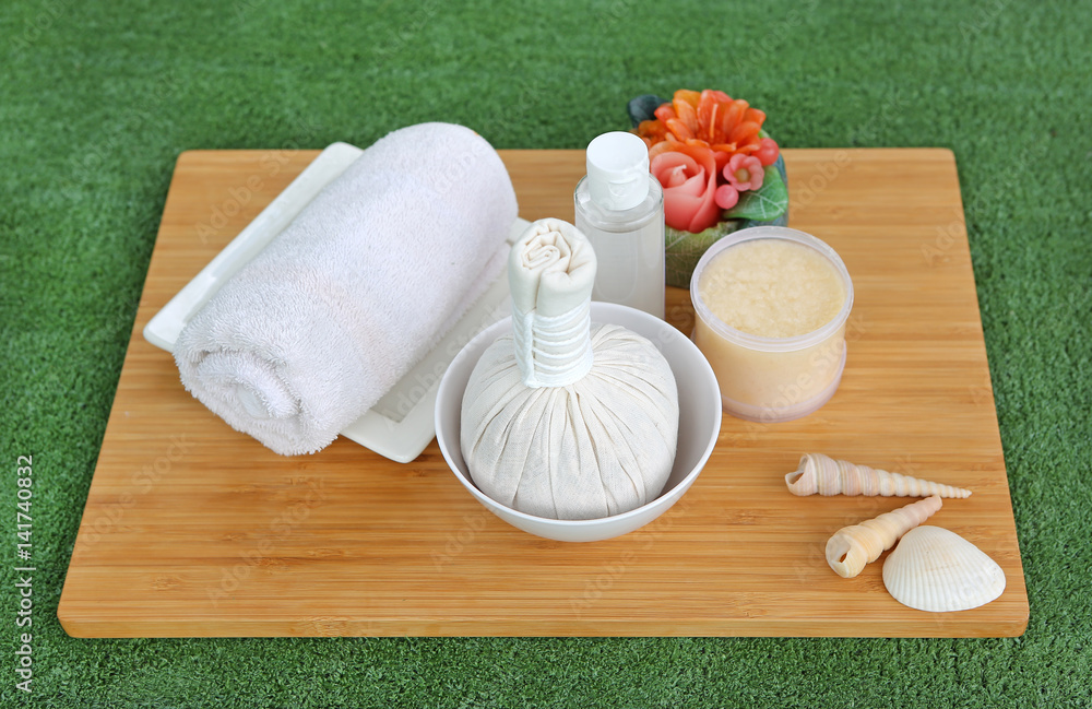 Spa herbal compressing ball with towels and Salt Scrub, Spa concept background Spa herbal compressing ball with towels and Salt Scrub, Spa concept background