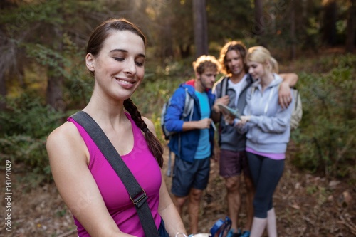 Smiling woman hiking with her friends © WavebreakMediaMicro