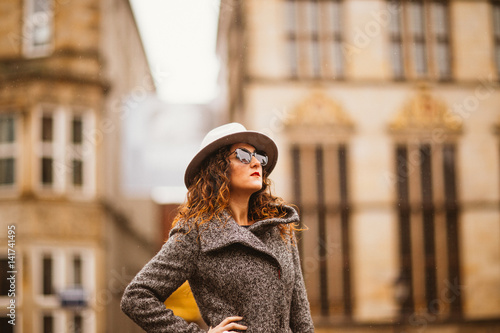 Beautiful Girl in the city centre with hat and sunglasses © jannis