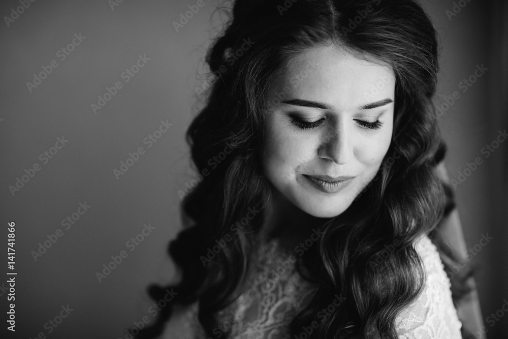 Bride with long silky hair waves closes her eyes leaning to the shoulder Bride with long silky hair waves closes her eyes leaning to the shoulder