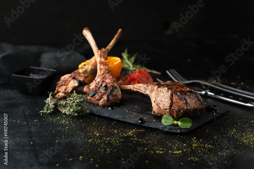 Grilled lamb rack with spices and sauce
