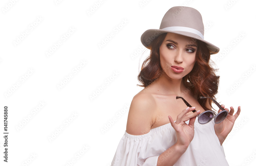 Woman wearing sunglasses and a hat. Summer vacation. Woman wearing sunglasses and a hat. Summer vacation.