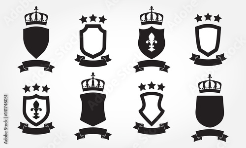 Shields set. Collection of different shield shapes with crown and stars. Heraldic royal design in flat style. Vector illustration.