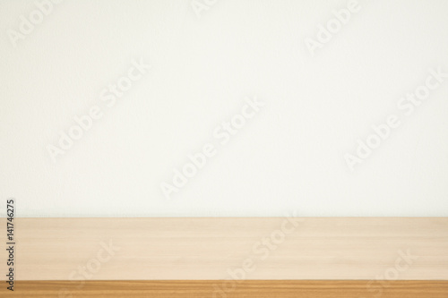 wooden table white wall background