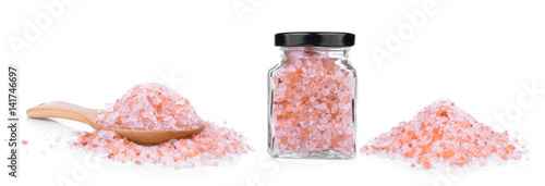 Foto Pink Himalayan salt on a wooden spoon isolated on white background