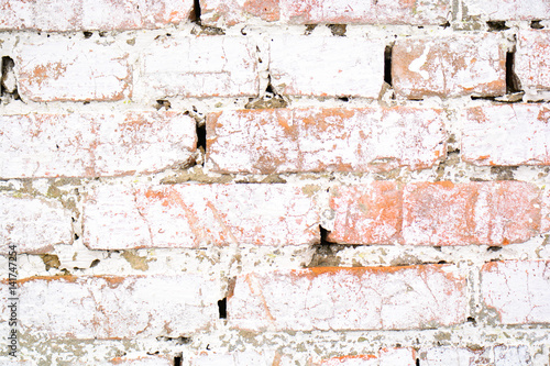 Ancient old brick white wall with moss. Brick Texture of old wall