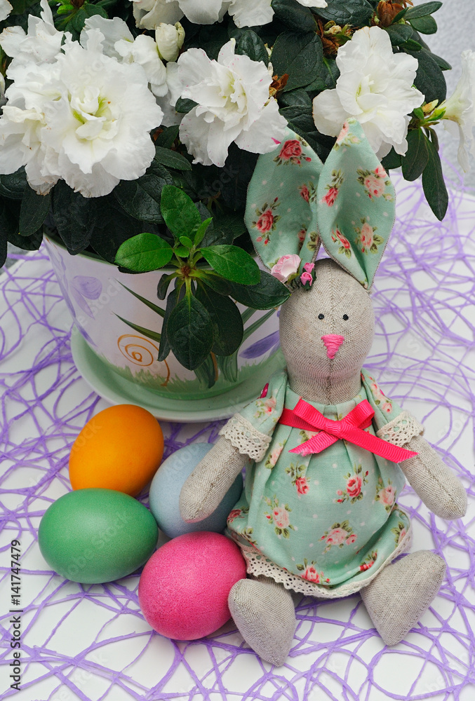 easter hare with colored eggs