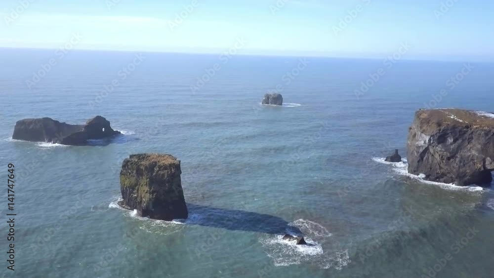 Dyrholaey Arch A Natural Rock Formation on the Coast of Iceland From the Air Dyrholaey Arch A Natural Rock Formation on the Coast of Iceland From the Air
