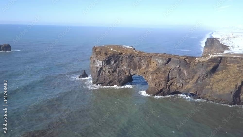 Dyrholaey Arch A Natural Rock Formation on the Coast of Iceland From the Air Dyrholaey Arch A Natural Rock Formation on the Coast of Iceland From the Air