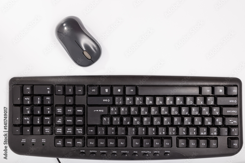 Black keyboard with a mouse on a white background. Isolate Black keyboard with a mouse on a white background. Isolate