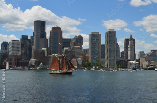 A Sailboat in Boston Harbor with the City in the Background