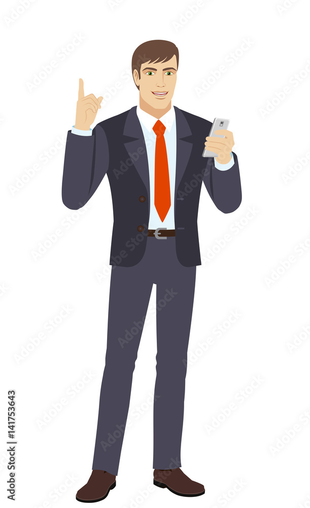 Businessman with mobile phone pointing up