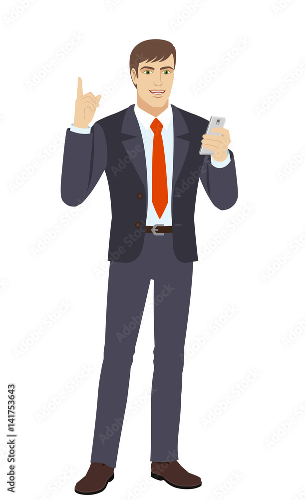 Businessman with mobile phone pointing up Businessman with mobile phone pointing up