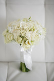 Wedding bouquet made of white roses on a white background