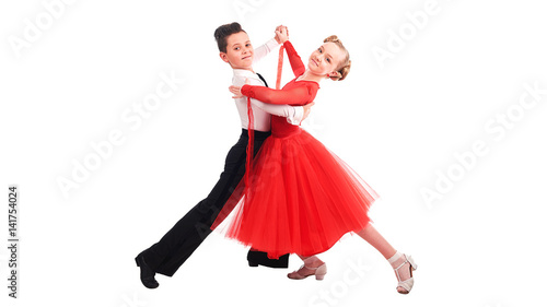 Lovely little boy and girl dancing. Isolated on white background