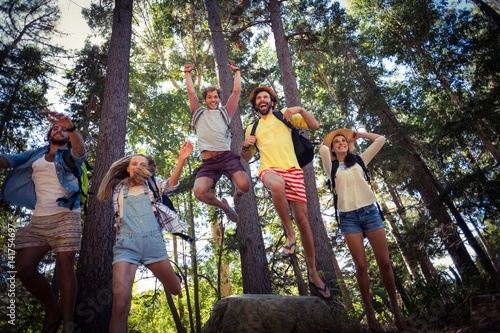 Foto Group of friends having fun in forest