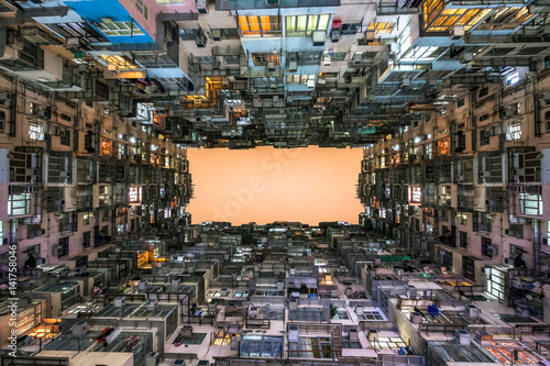 Low angle view of crowded residential towers in an old community in Quarry Bay, Hong Kong. Scenery of overcrowded narrow apartments, a phenomenon of high housing density & housing blues in Hongkong.
