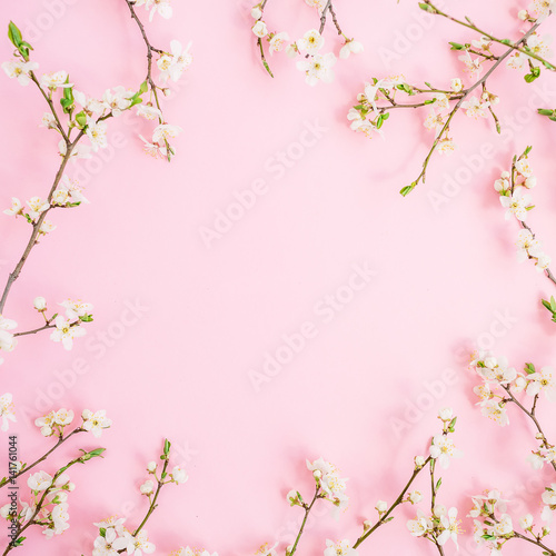 Spring flowers isolated on pink background. Flat lay, top view. Spring time background.