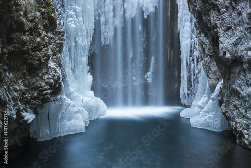 Italy, trentino south Tyrol, Non Valley, Waterfall from Smeraldo lake in winter. photo