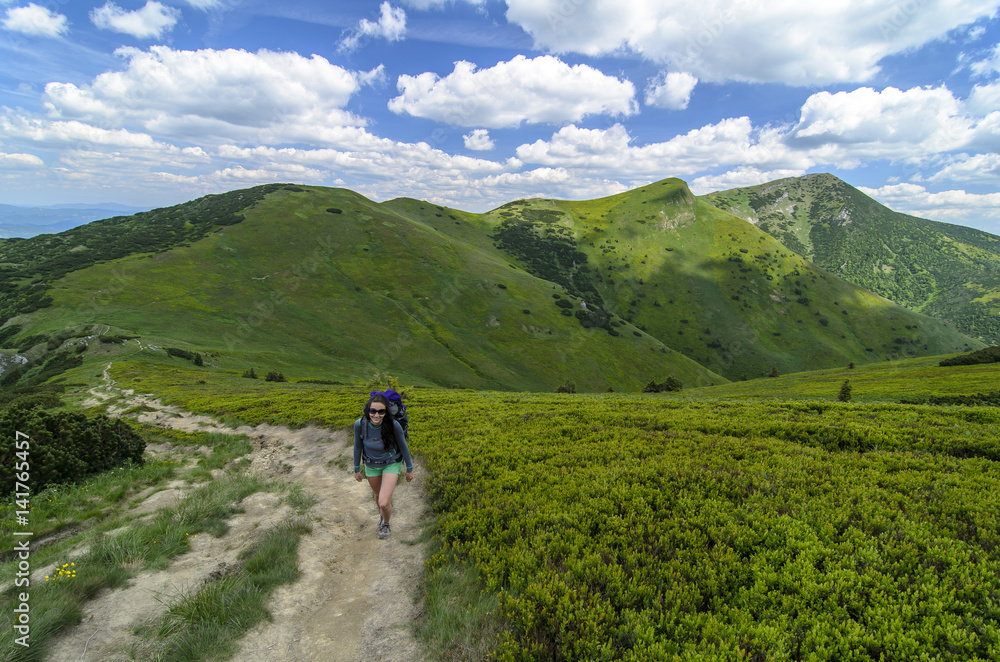 Woman tourist walking to top, Mala Fatra