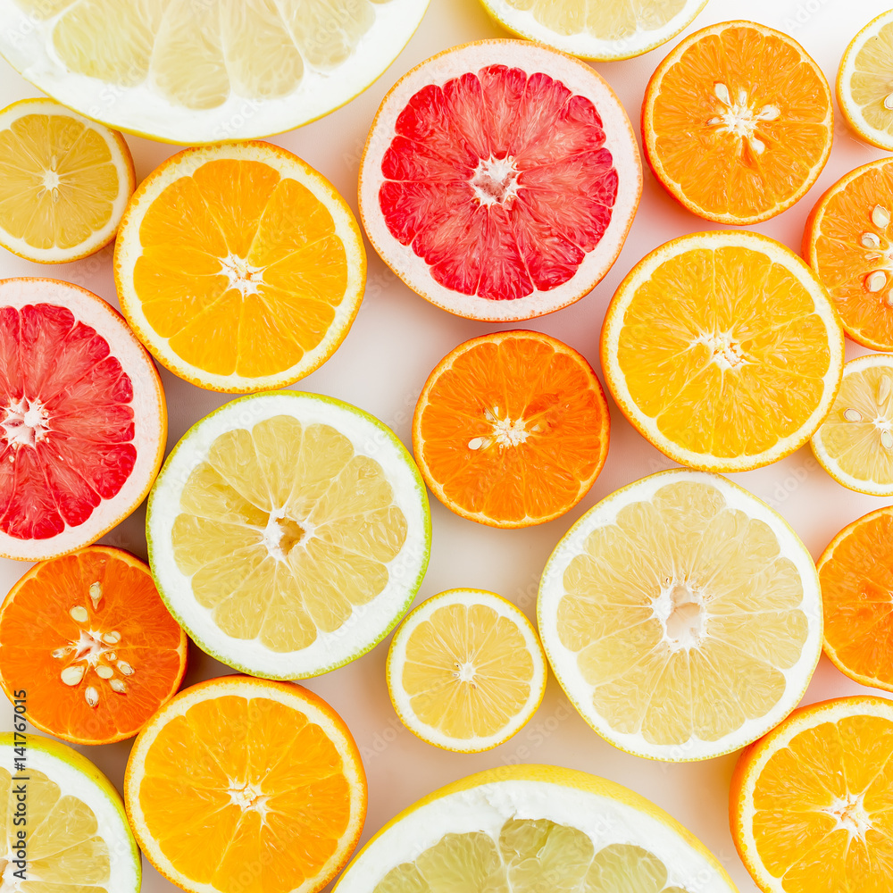 Fototapeta premium Lemon, orange, grapefruit, sweetie and pomelo on white background. Flat lay, top view. Food pattern