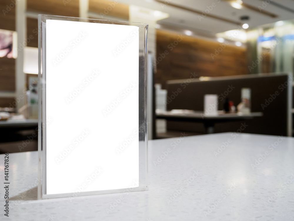 Mock up menu frame on table in the cafe restaurant Mock up menu frame on table in the cafe restaurant