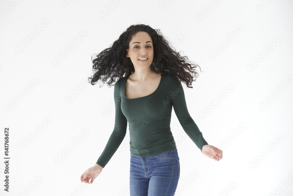Natural portrait of brunette girl shaking her hair on white background Natural portrait of brunette girl shaking her hair on white background