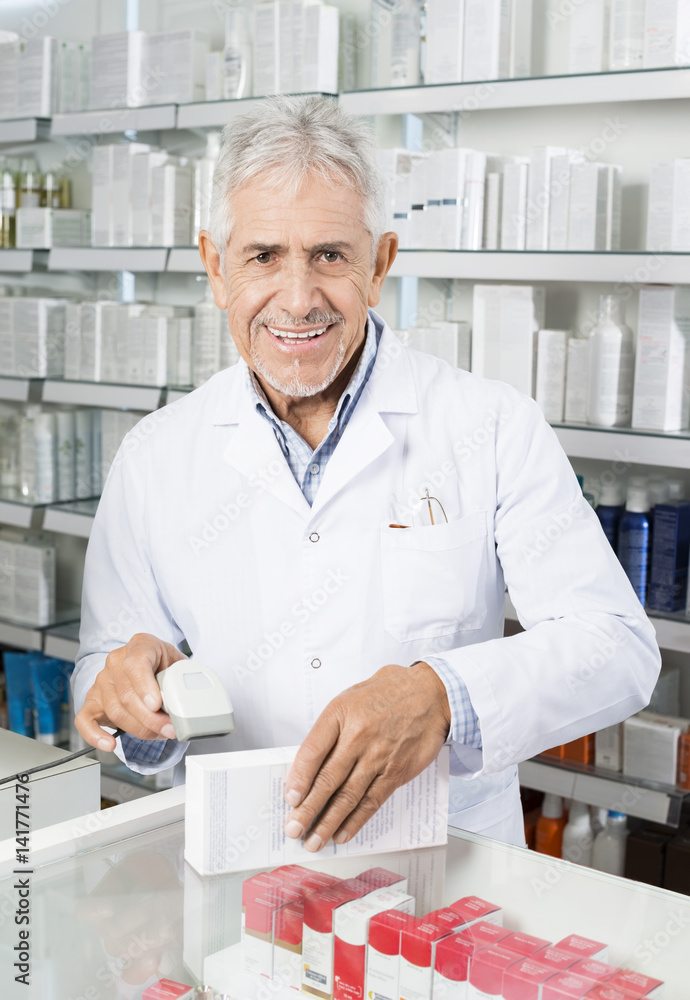 Portrait Of Chemist Scanning Barcode On Medicine Box Portrait Of Chemist Scanning Barcode On Medicine Box
