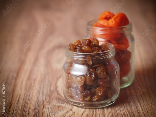 raisins dried apricots in a glass jar photo